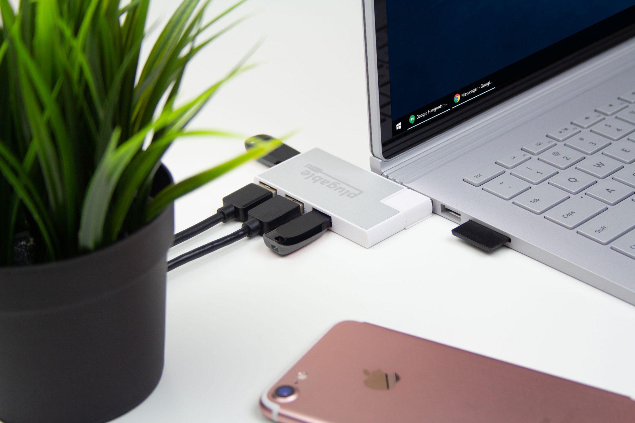 Plugable's USB3-HUB4R connecting four peripherals to a laptop