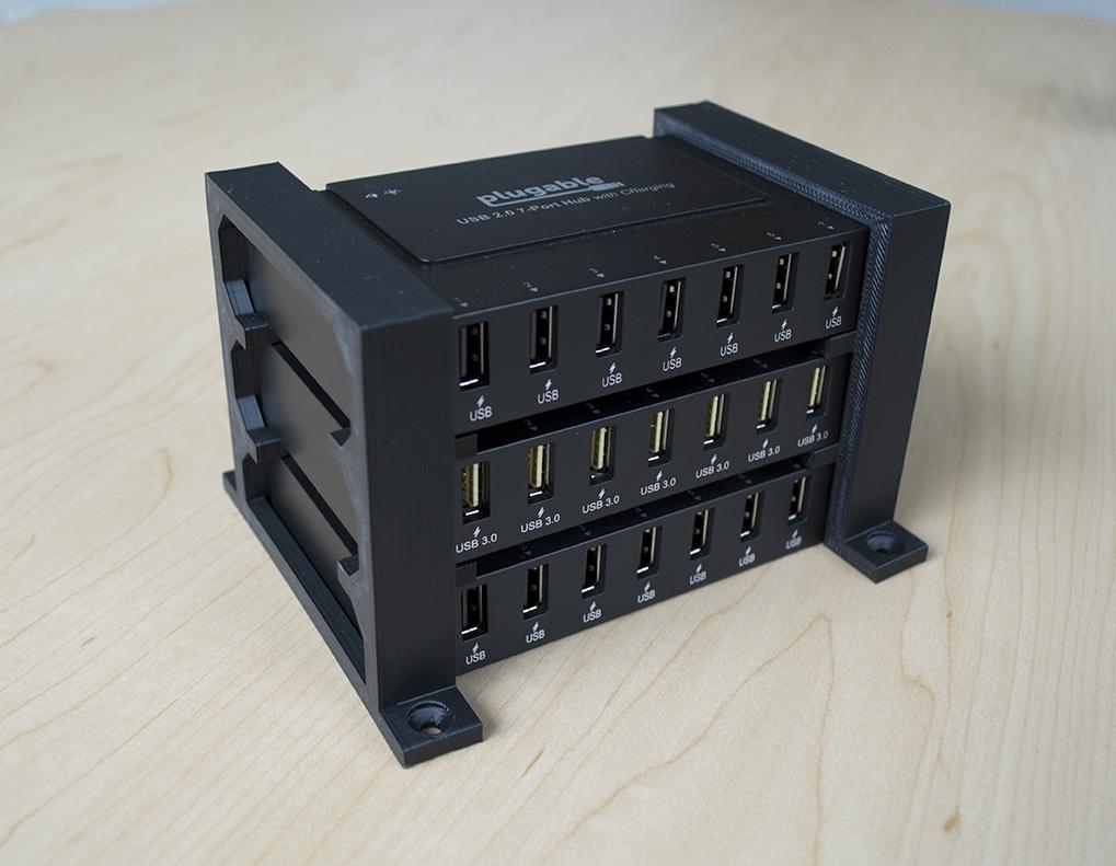 Three Plugable USB2-HUB7BC hubs stacked together using 3D-printed stands