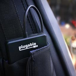 Image of the Plugable Solid State Drive fitting into a small pouch in a backpack