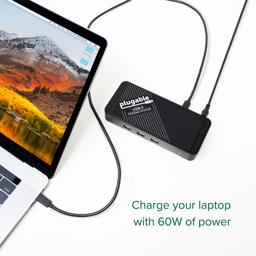 Thumbnail of Image of the Plugable USB-C Docking Station laying flat and charging a MacBook