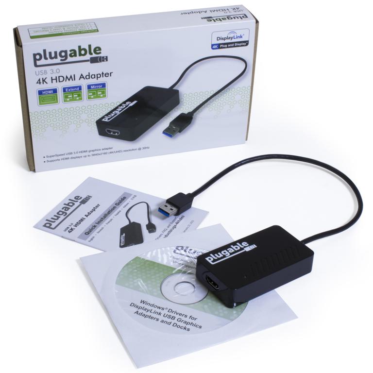 Image of the the product packaging, including the adapter, a Quick Start Guide, and a driver CD