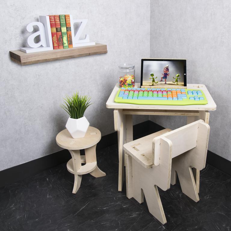Kids keyboard in use on top of table