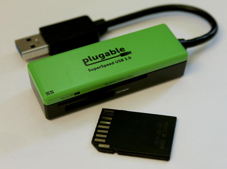 Image of the Plugable Multi-Card Reader with an SD card (not included)